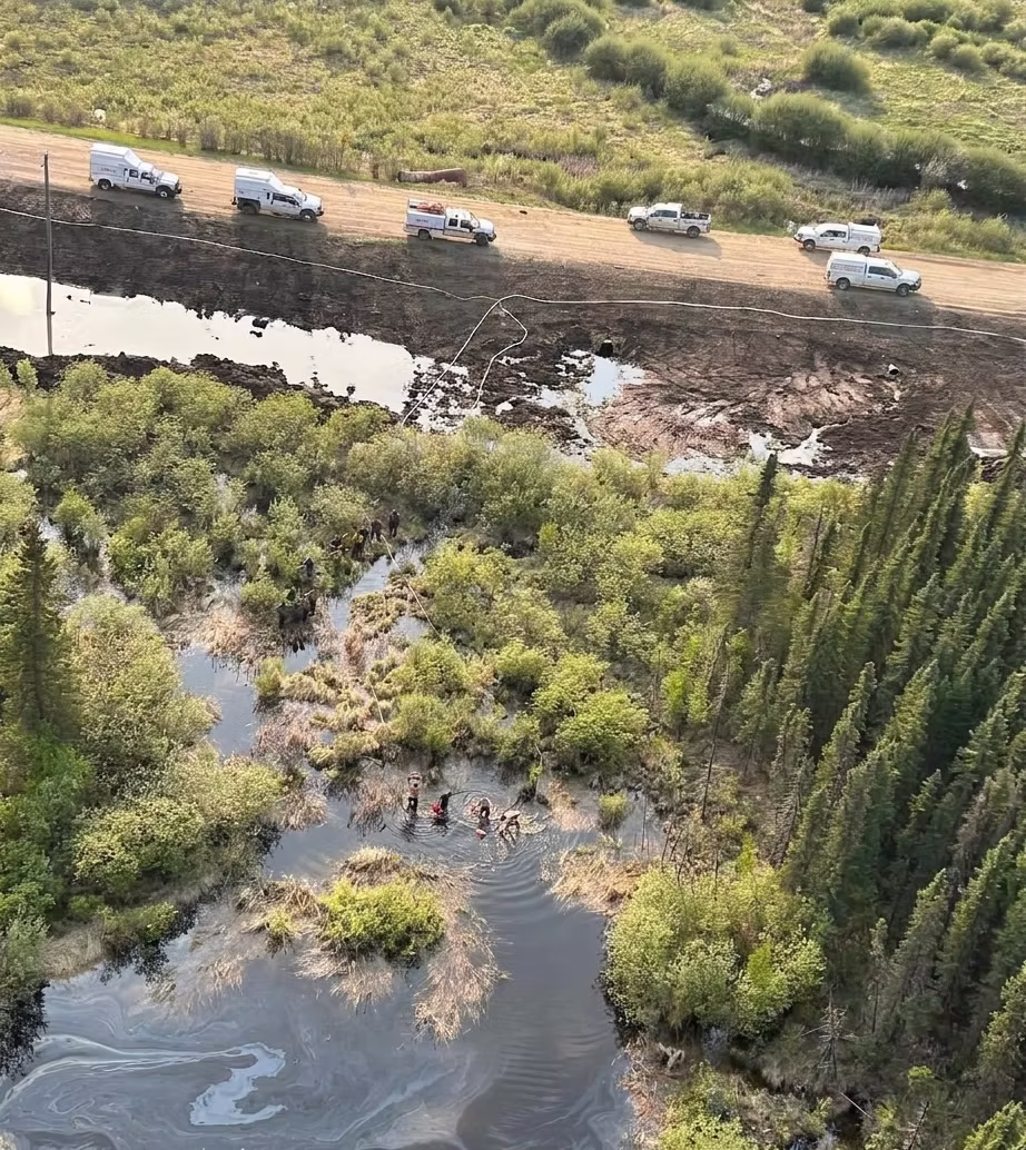 Aerial view of SRC field crews and support trucks staged along a wildland access road